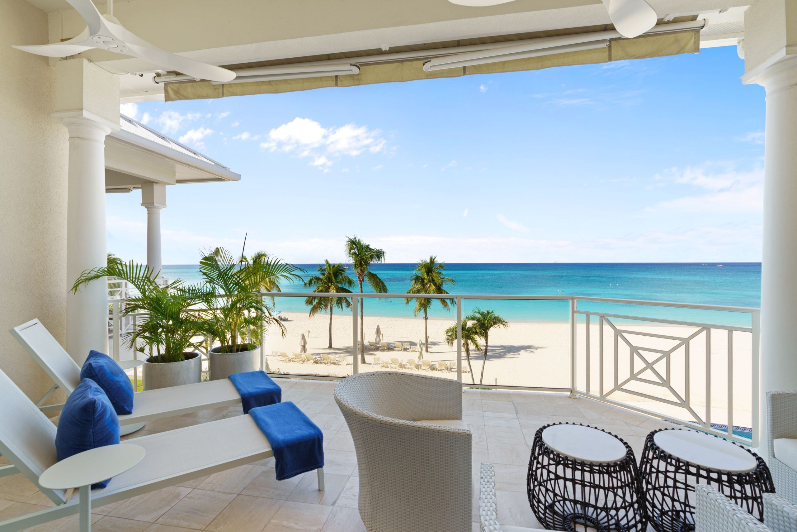 Elegant villa interior opening onto an ocean-view terrace