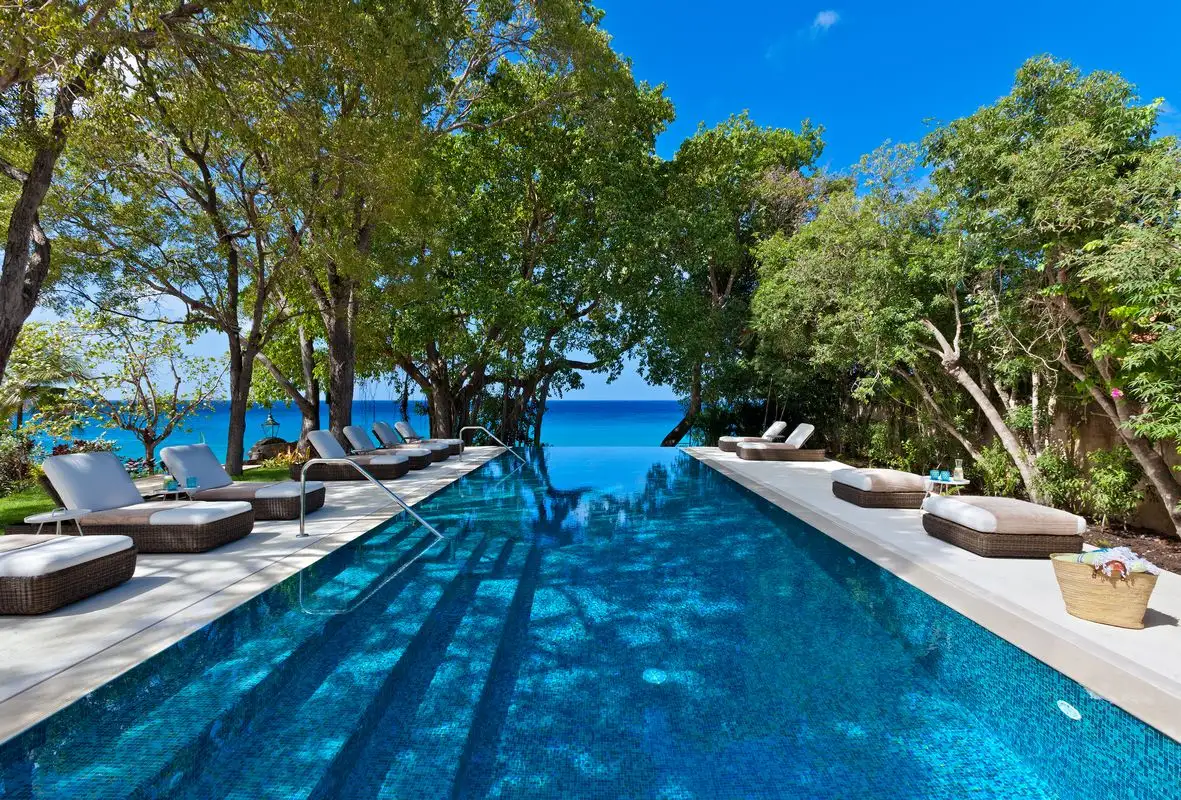A luxury Barbados coastal villa with a swimming pool and ocean-view terrace